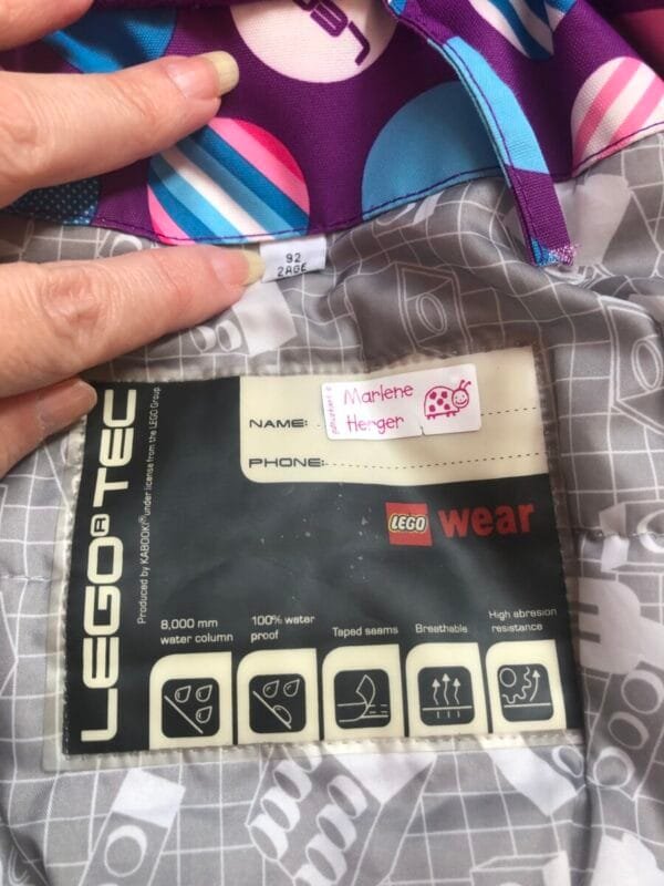 Polovna Lego jakna za zimu ljubicasta sa plavim i roze tufnama, velicine 92.