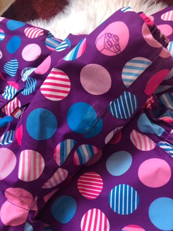 Polovna Lego jakna za zimu ljubicasta sa plavim i roze tufnama, velicine 92.