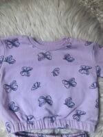 Trenerka sa leptiricima velicine 68.